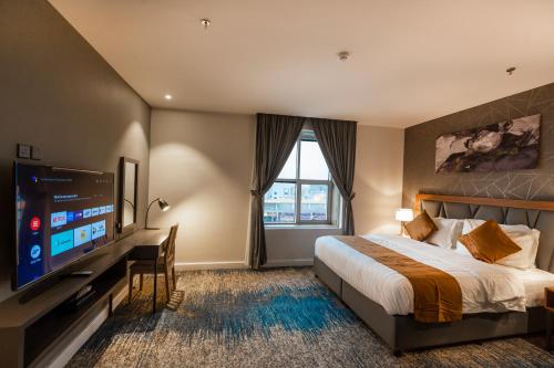 Кровать или кровати в номере دانة المروج للشقق المخدومة Danat Almourouj Serviced Apartment