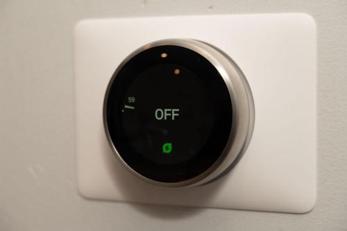 a white alarm clock with the off sign on it at Prime OTR steps to Vine St, Lux Full Bed, Workspace, fast WiFi, 50in Smart TV, Sleeps 3ppl in Cincinnati