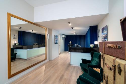 a salon with a mirror and a green chair at Park Regis City Centre in Sydney