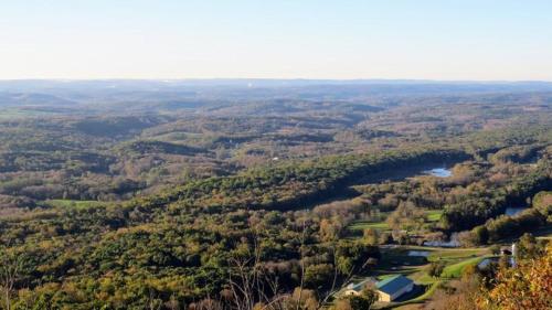 an aerial view of a valley with trees and a river at Holiday Inn Express Hotel & Suites Newton Sparta by IHG in Newton