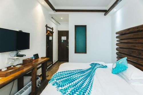 Cama o camas de una habitación en Hotel California Zhangjiajie