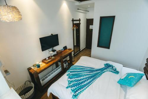 Cama o camas de una habitación en Hotel California Zhangjiajie