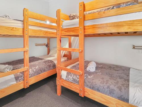 a bedroom with bunk beds in a dorm room at SKI View 4 in Mount Buller