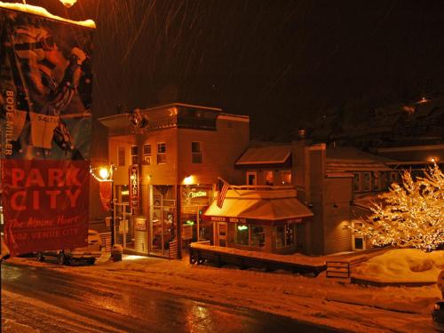 a city at night with a christmas tree and buildings at Treasure Mountain Inn in Park City