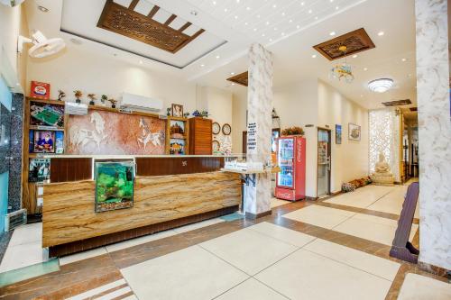 a lobby of a store with a counter at Hotel Karan Residency Amritsar - Golden Temple in Amritsar