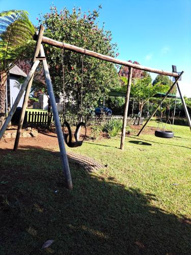 an empty swing set in a park at Horizon View Chalets in Graskop