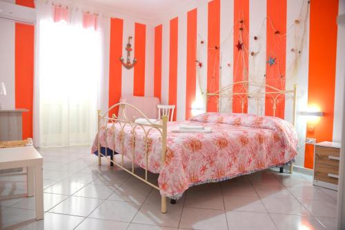 En eller flere senge i et værelse på CASA VACANZE BELVEDERE