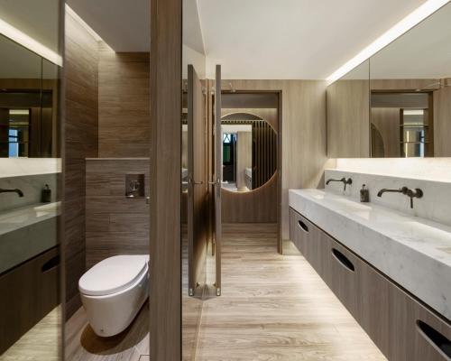 a bathroom with a toilet and two sinks at ST Signature Tanjong Pagar, DAYUSE, 8 hours, 10AM-6PM in Singapore