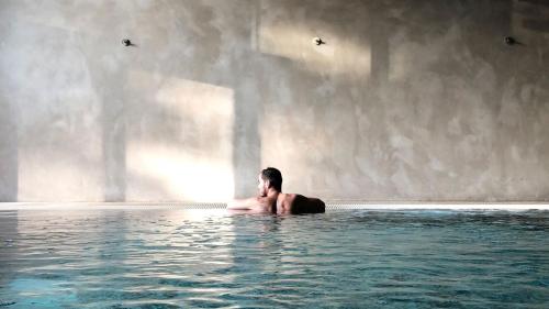 a man in the water in a swimming pool at blooming in Bergen