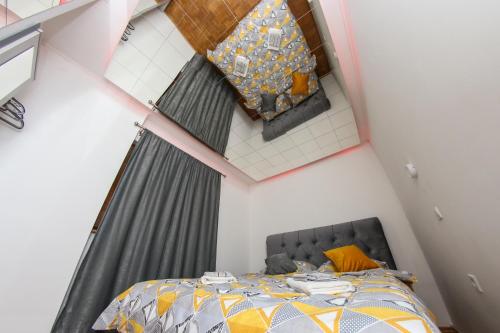 an overhead view of a bed in a small room at Hedonist Spa Jacuzzi Sarajevo Free parking in Sarajevo