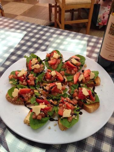 a plate of food with sandwiches on a table at Stephen Center B&B in Tirana