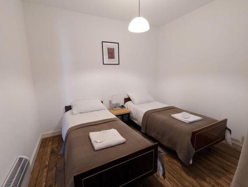a room with two beds in a room at Dsegh Village House in Dsegh