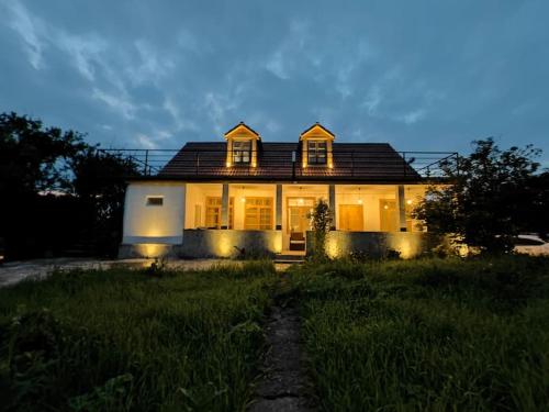 a house with its lights on in the yard at Dsegh Village House in Dsegh