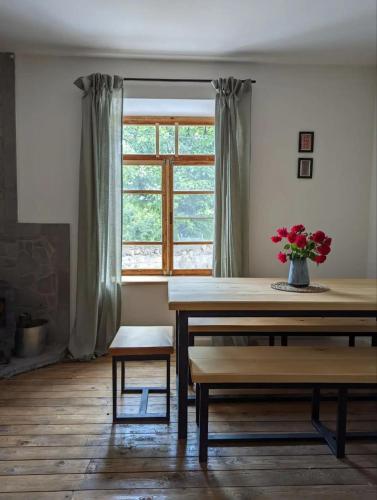 a dining room with a table and a window at Dsegh Village House in Dsegh
