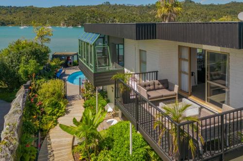 an aerial view of a house with a pool at Oceans 88 Whitianga Coastal Suites in Whitianga