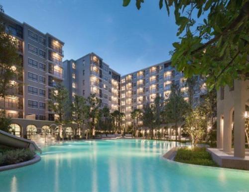 a large swimming pool in the middle of a building at La Casita HuaHin by Tasing in Hua Hin