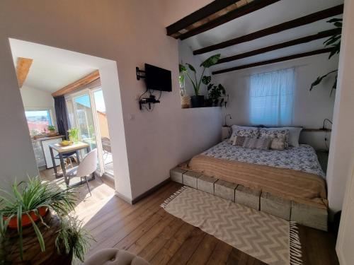 a bedroom with a bed and a television in it at Casa 39 Apartments in Rovinj