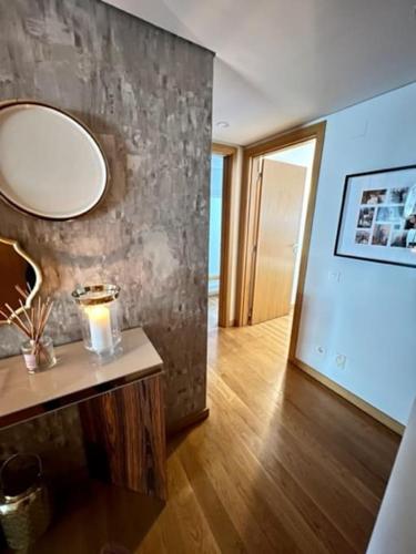 a room with a mirror and a table with a candle at Becas House - Lisboa in Lisbon