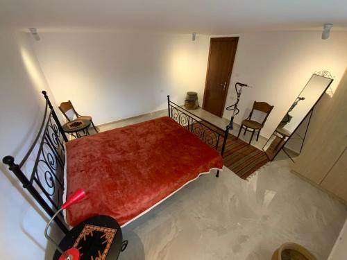 an overhead view of a room with a bed and chairs at Bethlehem-the-Wall Apartment in Bethlehem