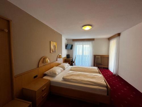 Postel nebo postele na pokoji v ubytování Gletscherblick