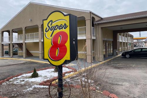 a super sign in front of a building at Super 8 by Wyndham Junction City in Junction City