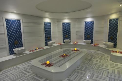a large bathroom with a tub with candles in it at Ramada Plaza by Wyndham Istanbul Asia Airport in Gebze