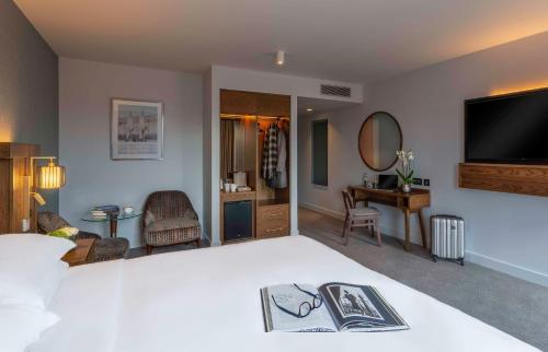 a hotel room with a bed and a television at Hyatt Centric The Liberties Dublin in Dublin