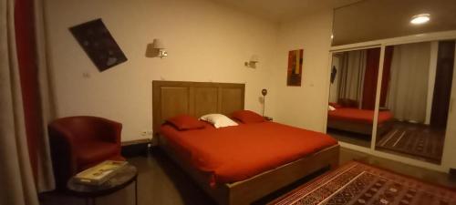 En eller flere senge i et værelse på Residence La Casa Blanca