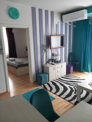 Кровать или кровати в номере City Apartment