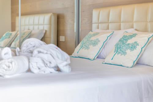 Cama o camas de una habitación en The Seashore - Residenze esclusive Vista Mare