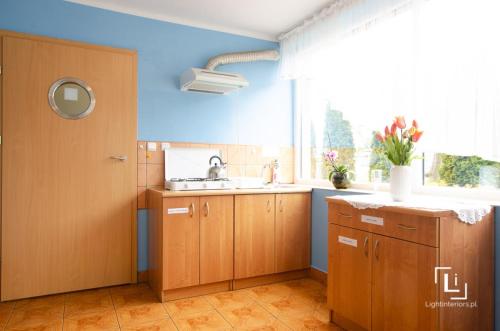 A kitchen or kitchenette at Pokoje Grażyna