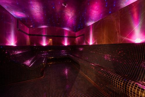 a room with purple lights on the wall at ibis Styles Nowy Targ in Nowy Targ
