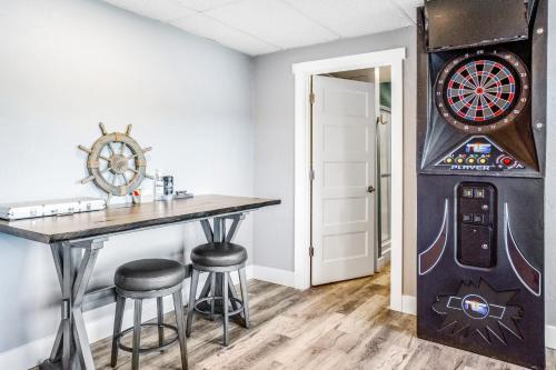 a room with a table and a dart board at Fun & Games in Union