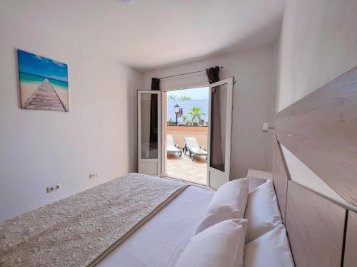 Postel nebo postele na pokoji v ubytování Sun Days Corralejo iRent Fuerteventura