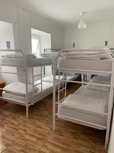 a room with four bunk beds in it at Aurora Place in Lisbon