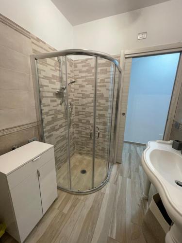 a bathroom with a shower and a sink at NEWHOUSE ROOFTOP in Nettuno