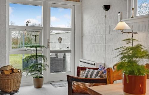 a living room with a window and some plants at Awesome Home In Middelfart With Wifi And 2 Bedrooms in Middelfart