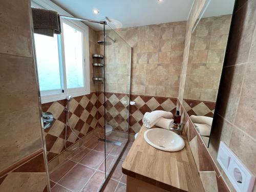 a bathroom with a sink and a shower at Calle Carabeo 57 in Nerja