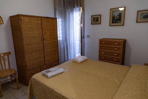 Postel nebo postele na pokoji v ubytování L'isola Che Non C'è