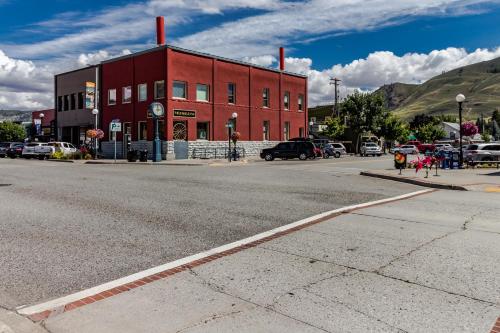 a red building on the side of a street at Park Pointe Lakeside Retreat A101 in Chelan