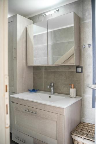 a bathroom with a sink and a mirror at Villa Eva Dikella in Mesimvría