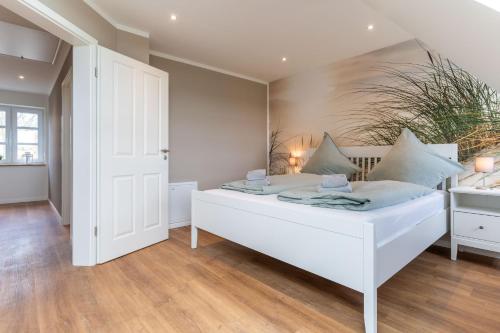 Ένα ή περισσότερα κρεβάτια σε δωμάτιο στο DHH Lahnung