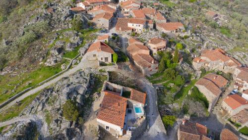 an aerial view of a village on the side of a mountain at El Escondite del Agua in Trevejo