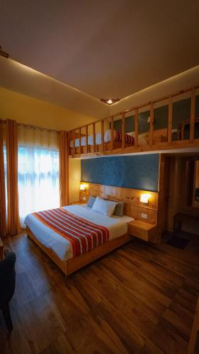 Postel nebo postele na pokoji v ubytování Namlang Resort