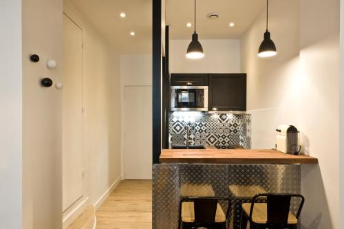 Cuina o zona de cuina de Pick A Flat's Apartment near Montmartre - Rue de Navarin