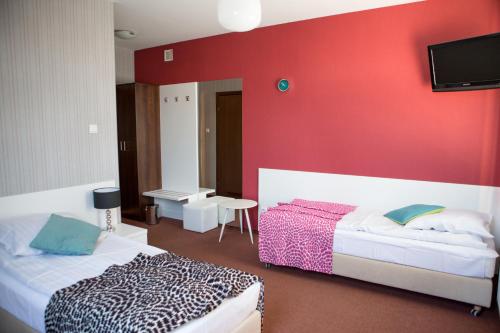 Кровать или кровати в номере Hotel Na Rogatce