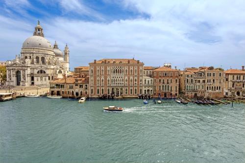 a view of a city with boats in the water at The Gritti Palace, a Luxury Collection Hotel, Venice in Venice