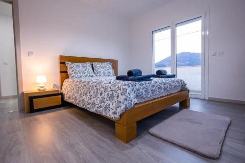 Ένα ή περισσότερα κρεβάτια σε δωμάτιο στο Prestígio Home