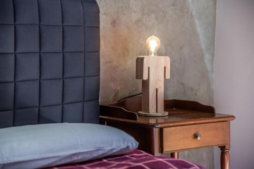 Gîte Le Jorat - Appartement Bにあるベッド
