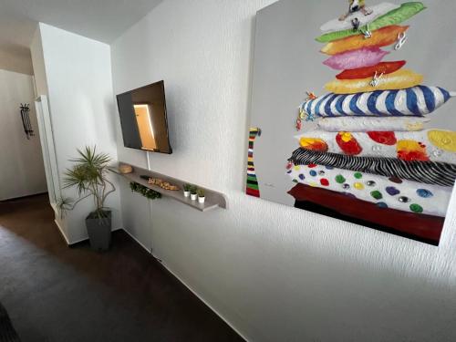 a living room with a painting on the wall at Hotel Abtshof in Halberstadt